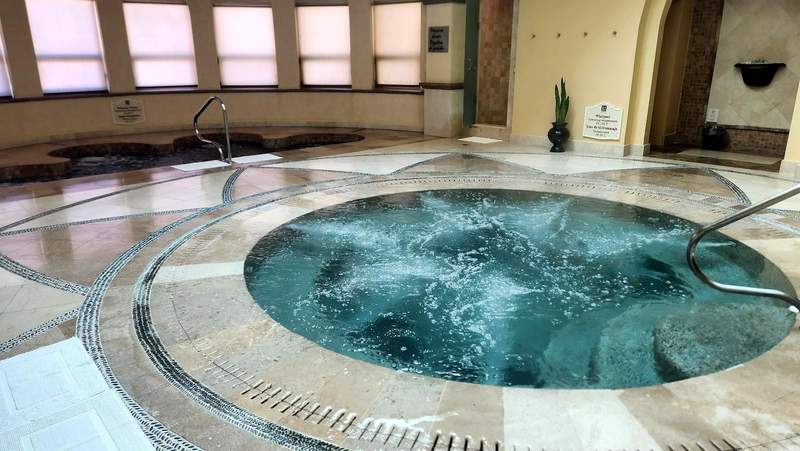 Large hot tub next to smaller hot tub.
