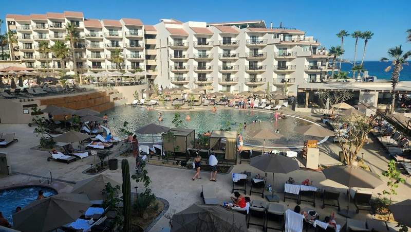 Busy pool area at Villa del Palmar Resort and Spa in Cabo San Lucas.