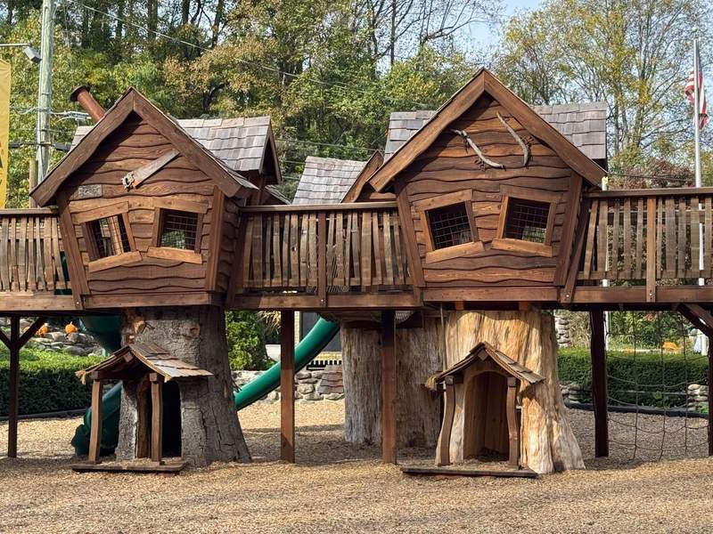 A wooden playground for children at the Townsend Great Smokies KOA.