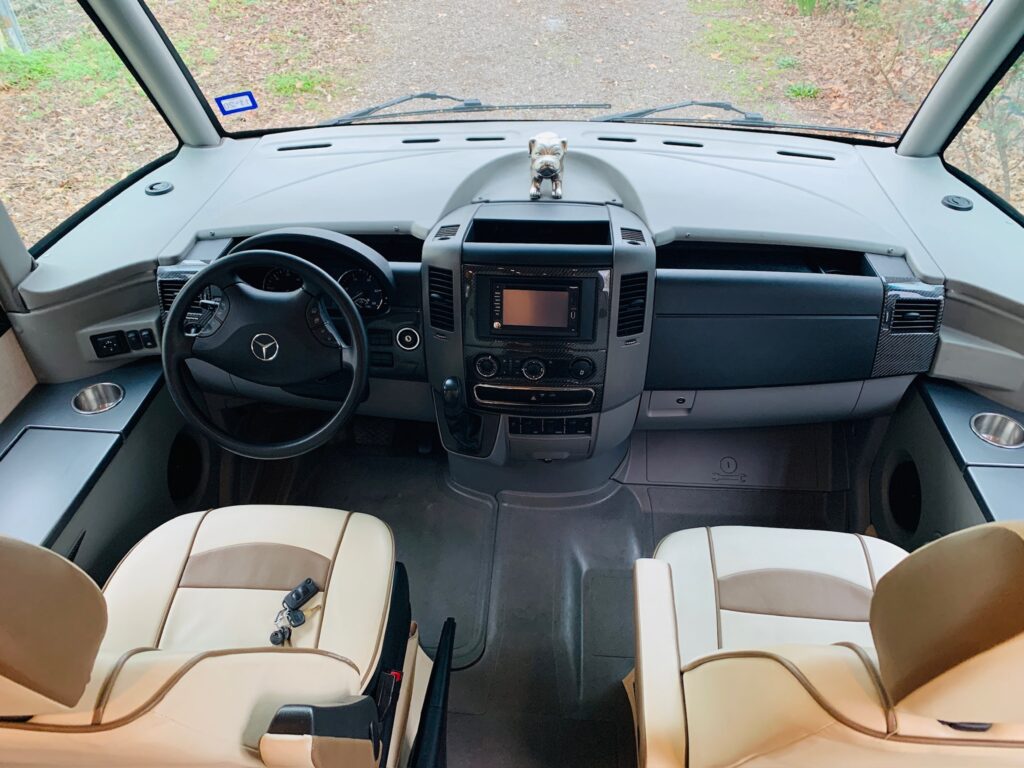 Front seat of an RV rented from RVshare with plenty of room for driver and passenger.