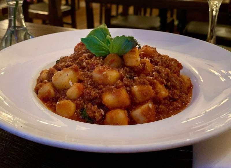 Bowl of gnocchi bolognese at Senza Gluten in New York City