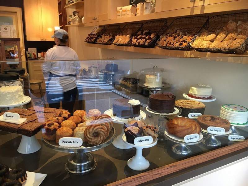 Gluten free baked goods in a pastry case at By the Way Bakery in New York City.
