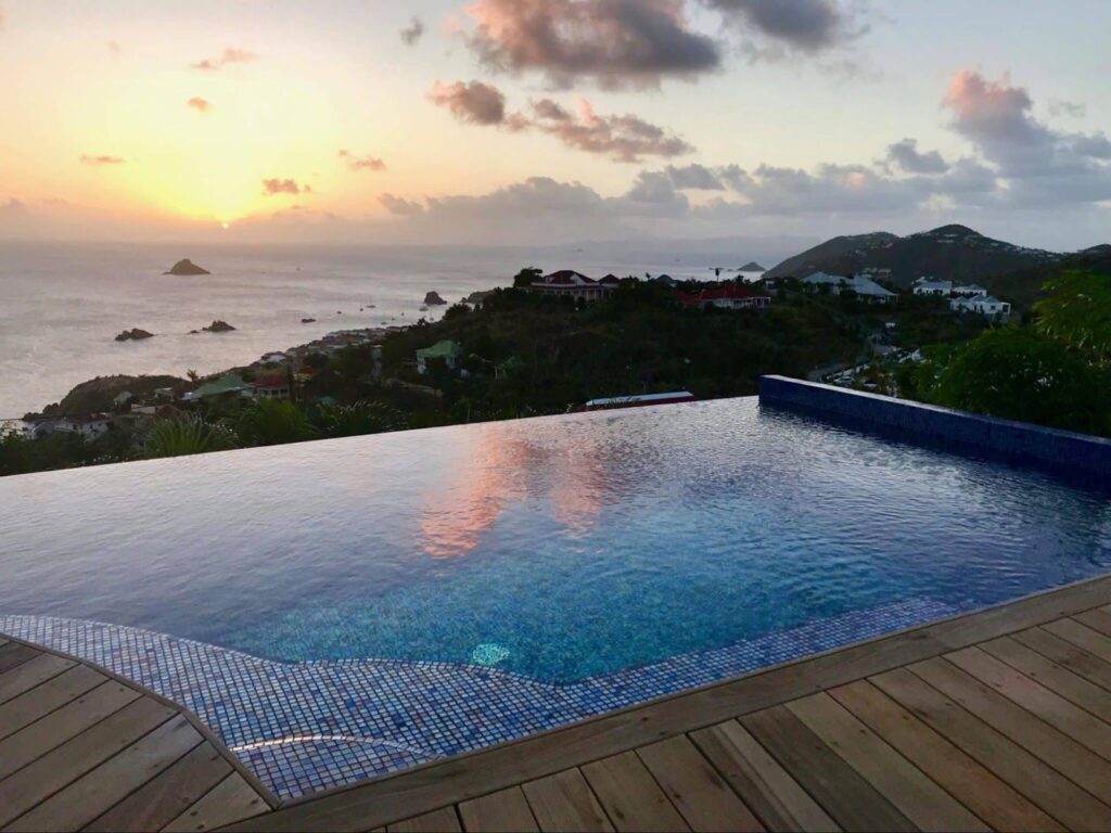 caribbean sunset with a private beach house pool