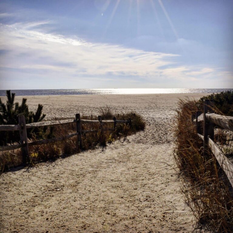 private beach walkway with sun shining