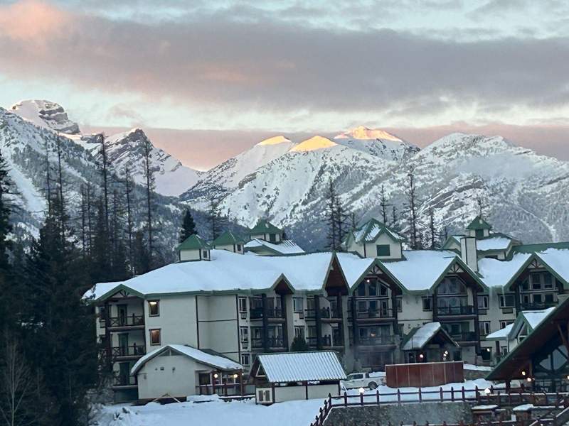 Exterior shot of the Lizard Creek Lodge at sunset at Fernie Alpine Resort.