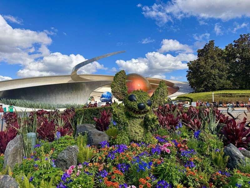 Stitch topiary surrounded by flowers at Epcot