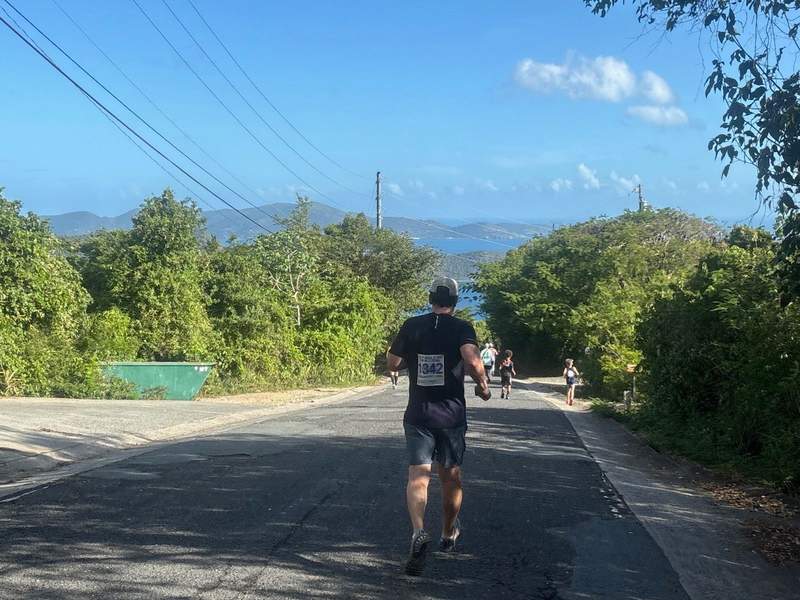 Running towards the end of 8 Tuff Miles with the sea in the distance.