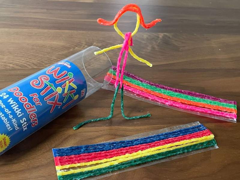 Wikki Sticks are positioned on a table for play.