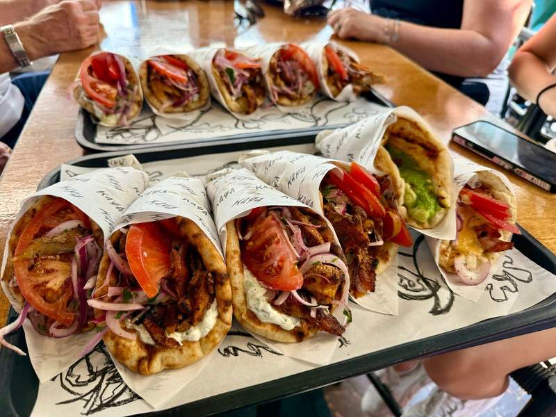 Pita wrapped food on a tray.