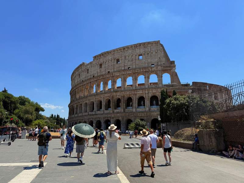 Street-level view walking up to the Colosseum.