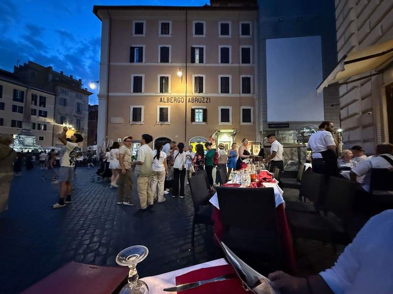 view across crowded square at hotel.