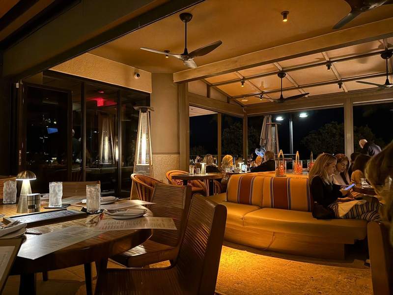 Nighttime view of cozy restaurant S3 at the Hilton Beach House in Fort Lauderdale