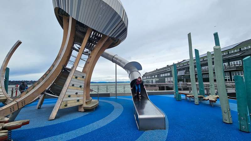 A young girl playing on a playground shaped like a jellyfish along the Seattle Waterfront 