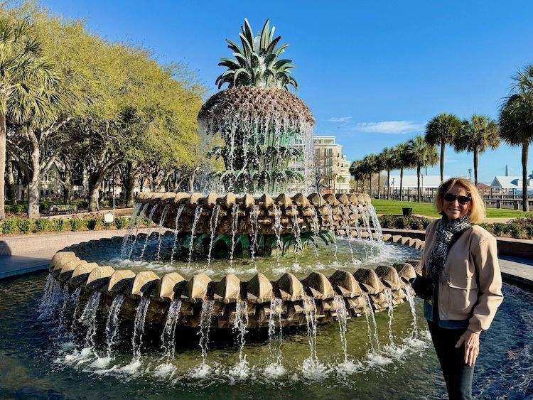 Author standing beside the Pineapple Fountain at Waterfront Park in Charleston 