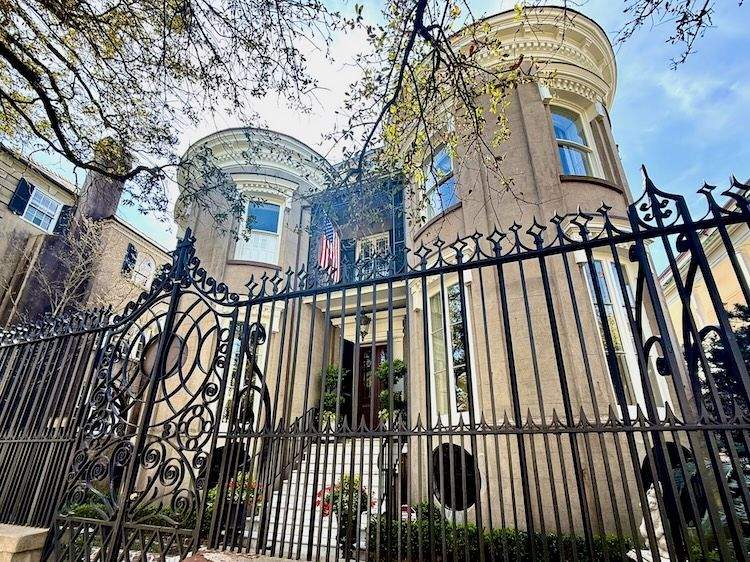 Antebellum home with a tall iron fence on Charleston’s South of Broad Tour