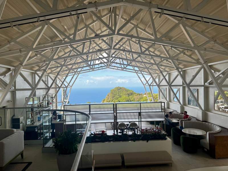View from the lobby and bar of The Scenery hotel on Saba overlooking the island’s lush landscape and ocean.