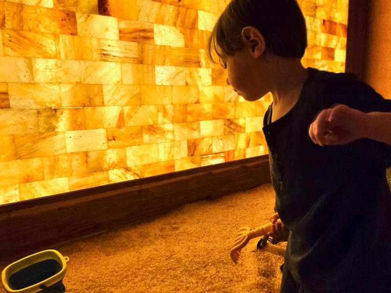 Child playing in the salt box at Temecula Salt Cave. 