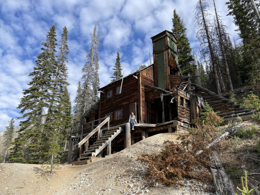 Brown timbered exterior of the Wolf Mine in Kirwin, near Yellowstone