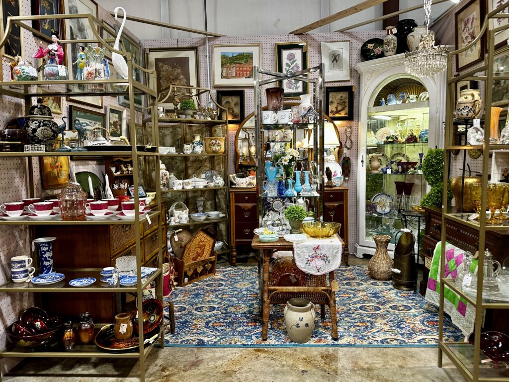 Shelving units housing collections of antique china, figurines and vases at Virginia Vintage, an antiques store in Christiansburg, VA.