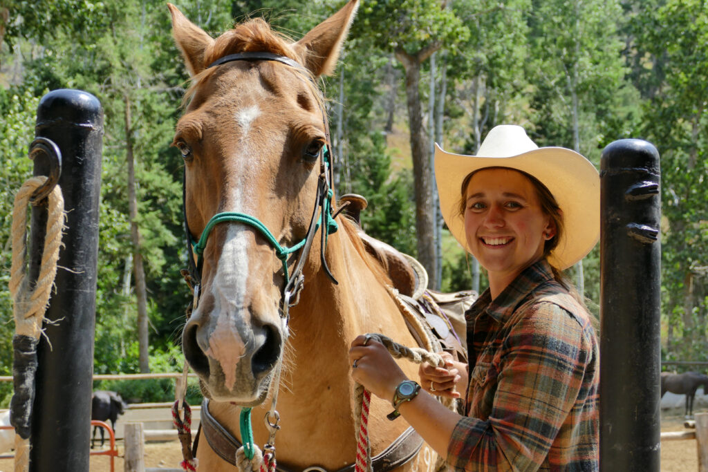 Horse and female guide at Bill Cody Ranch in Wyoming