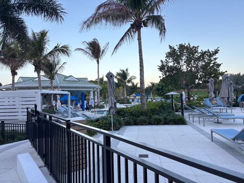 Pool area at the Belgrove Resort & Spa with pool bar and lounge chairs in distance