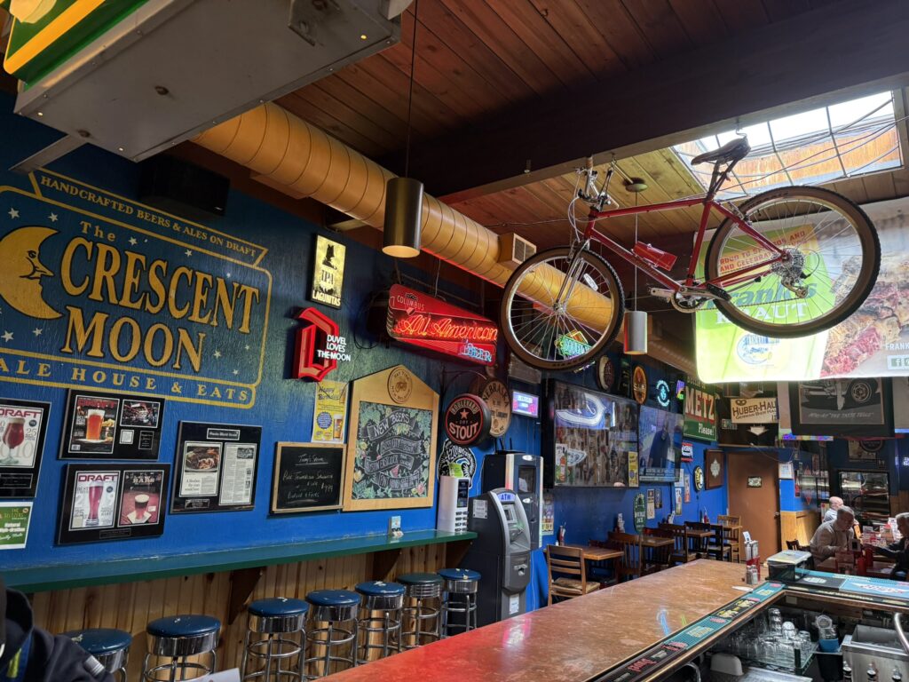 The retro dive bar atmosphere of The Crescent Moon Alehouse in Omaha
