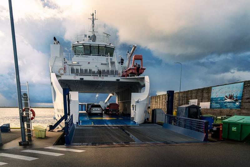 A small drive on/drive off ferry to Kinhu in dock during the loading process.