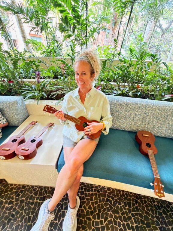 Kim Orlando taking a ukulele lesson at the Sheraton Waikiki.