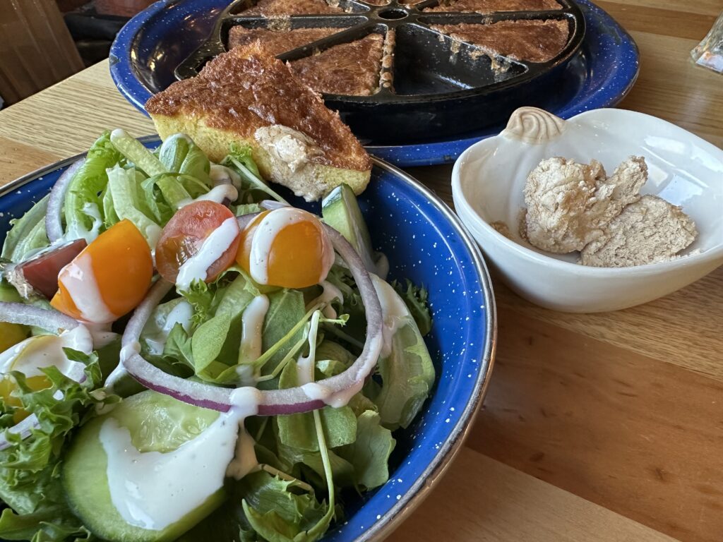 Side salad with ranch dressing, cast iron cornbread and clover honey at Campfire Grill at Massanutten Resort.