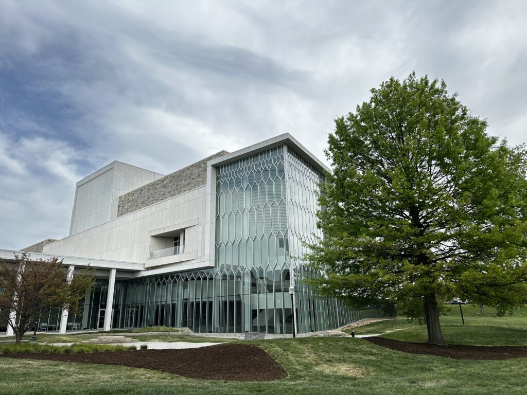 Exterior of the Center for the Arts at Virginia Tech, a building with a glass facade that resembles a honeycomb.