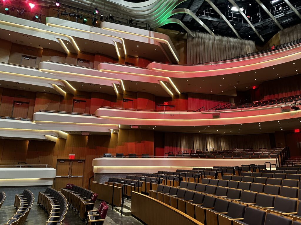 Balcony seating embellished with backlit facades in the Anne and Ellen Fife Theatre in Virginia Tech's Center for the Arts.