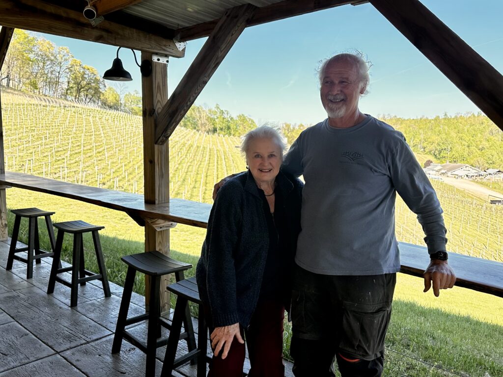 Joyce and Yvan Beliveau in front of their high elevation vineyard in Blacksburg, VA.