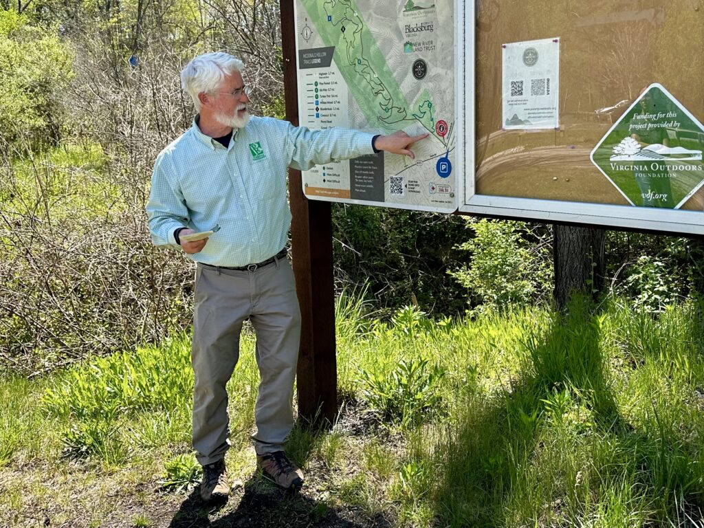 Dean Crane, Director of Blacksburg Parks and Recreation, points out highlights on the McDonald Hollow Trail Map.