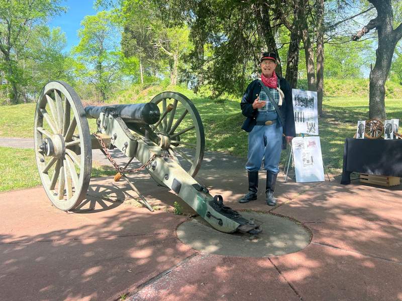 A Civil War interpreter demonstrates a canon. 