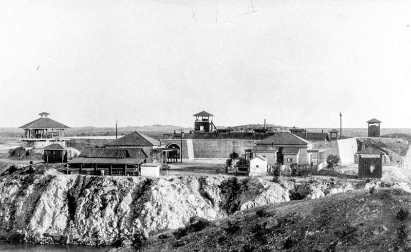 Historic black and white image of Yuma Territorial Prison showing prison buildings on Prison Hill.