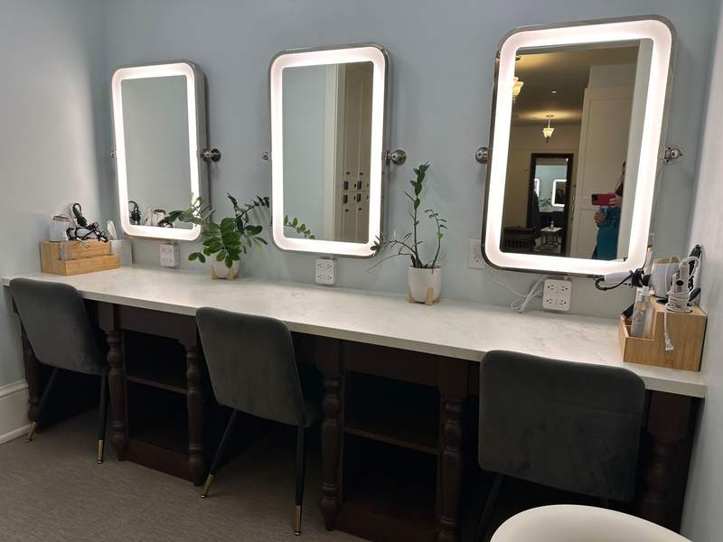 Vanity area with mirrors.