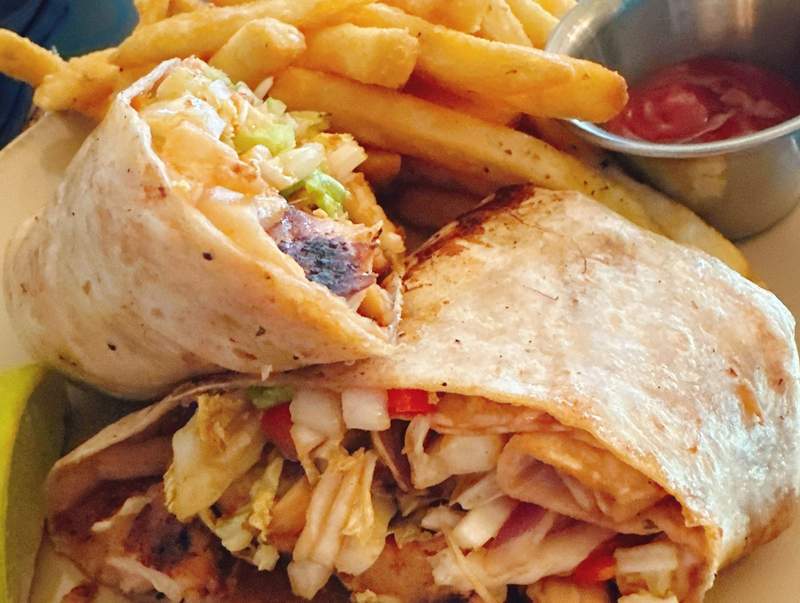A wrap with french fries. 