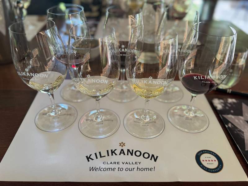 Seven glasses of wine on a a table at Kilikanoon winery in the Clare Valley.