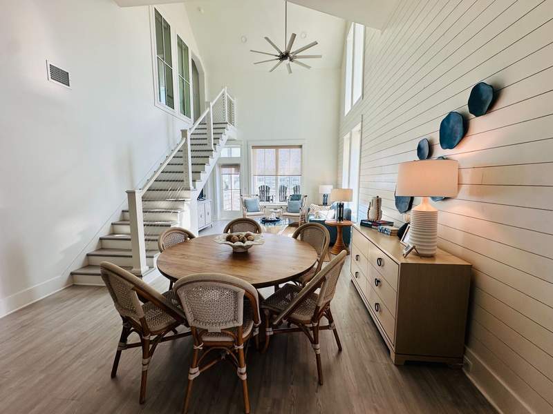 Our 4 bedroom condo was great with three teens. Open-air dining area with staircase and ceiling fan