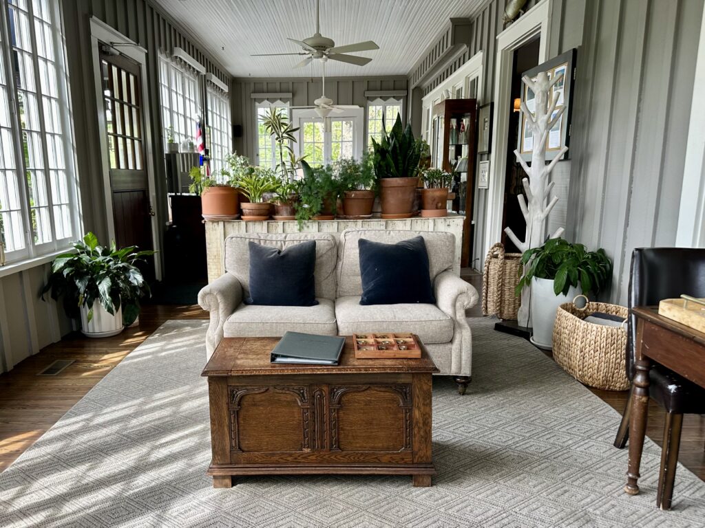 Plant filled sunroom at The Greystone Inn, a luxury boutique hotel for a group getaway in Western North Carolina