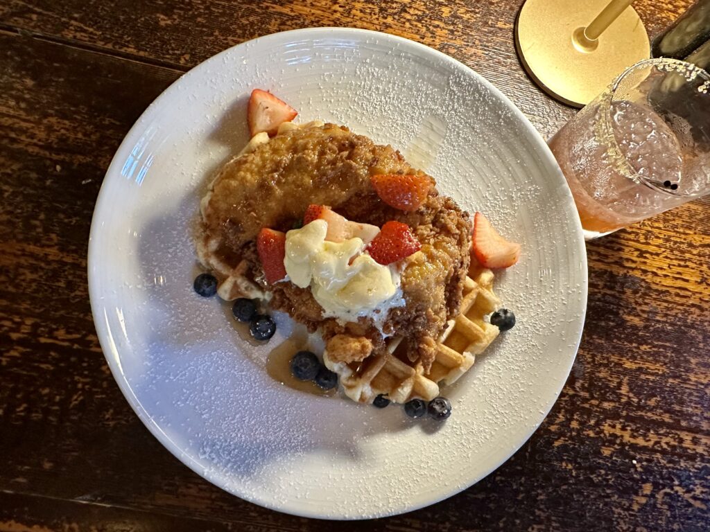 Whipped cream-topped chicken and waffles at Grand Old Station in Lake Toxaway, NC