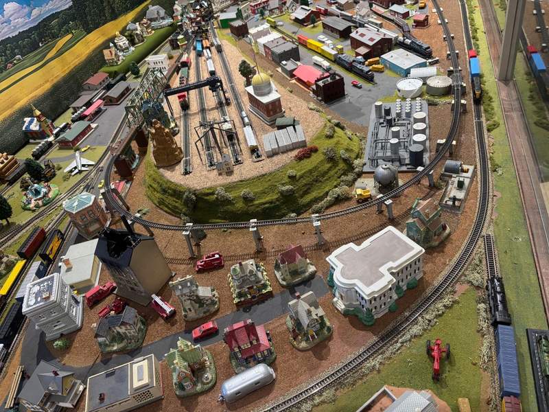 Model trains and buildings in a cityscape diorama