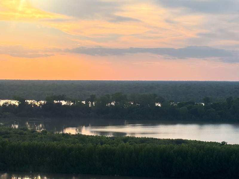 Get great views, including this sunset, from a rooftop bar