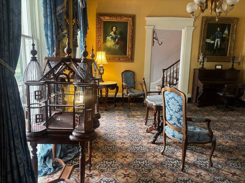 Period furniture - antique chairs and birdcage - at The Inn at Cedar Grove