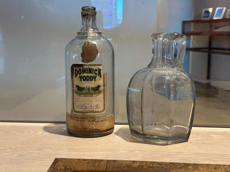 Two old bottles.  One with an old label.