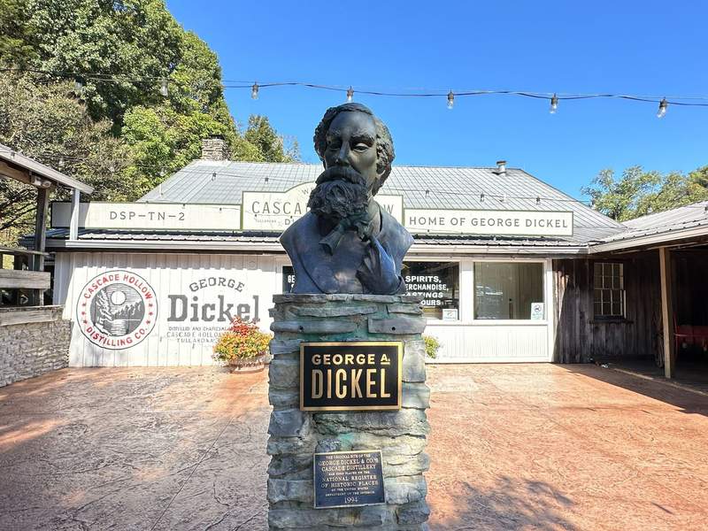 A bust statue in front of a building.