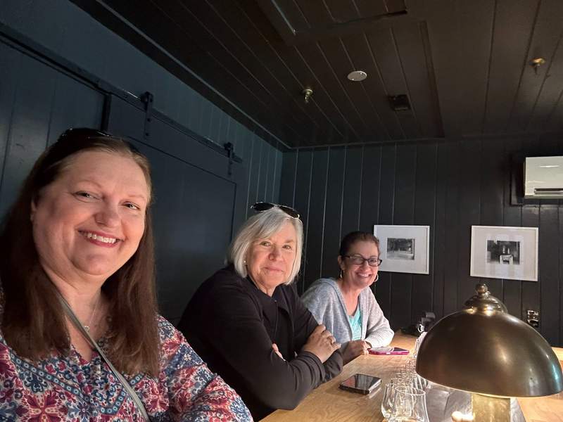 Three women at a table.