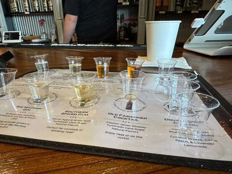 A mat with various shot glasses of spirits.