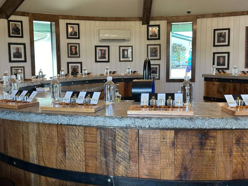 A circular bar set up for tasting spirits. 