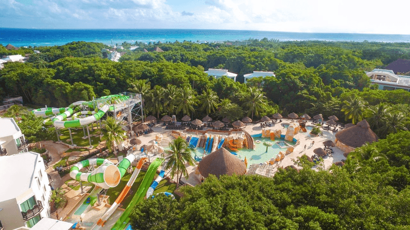 Aerial view of the water park and tropical grounds at Sandos Caracol Nature Resort in Playa del Carmen Mexico.